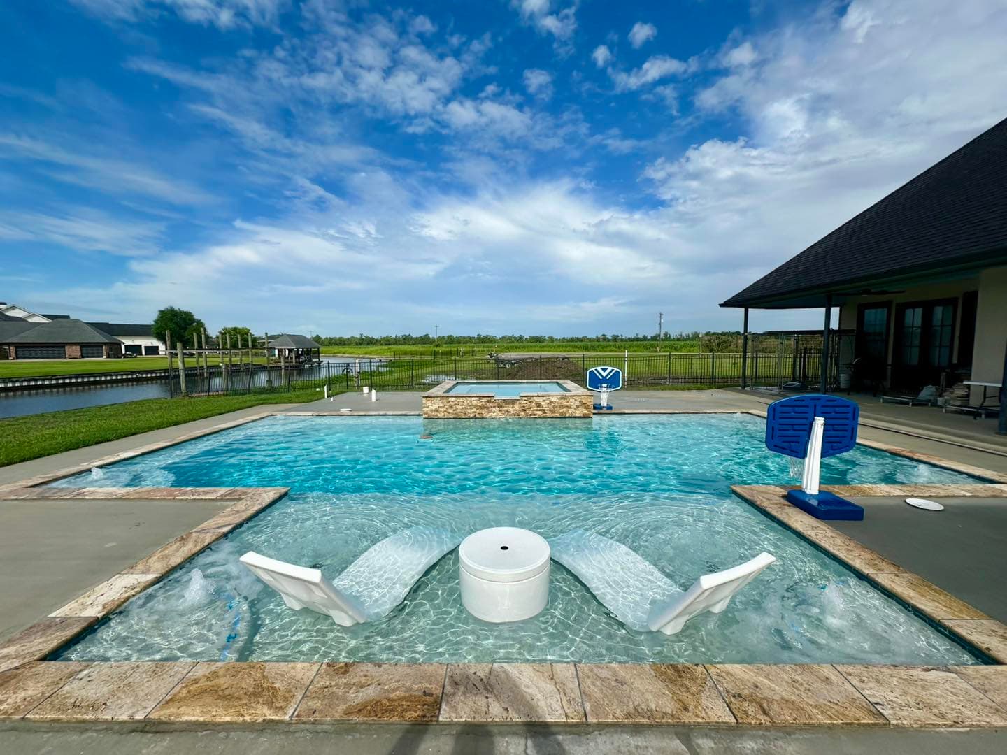 Family pool with Louisiana bayou backdrop