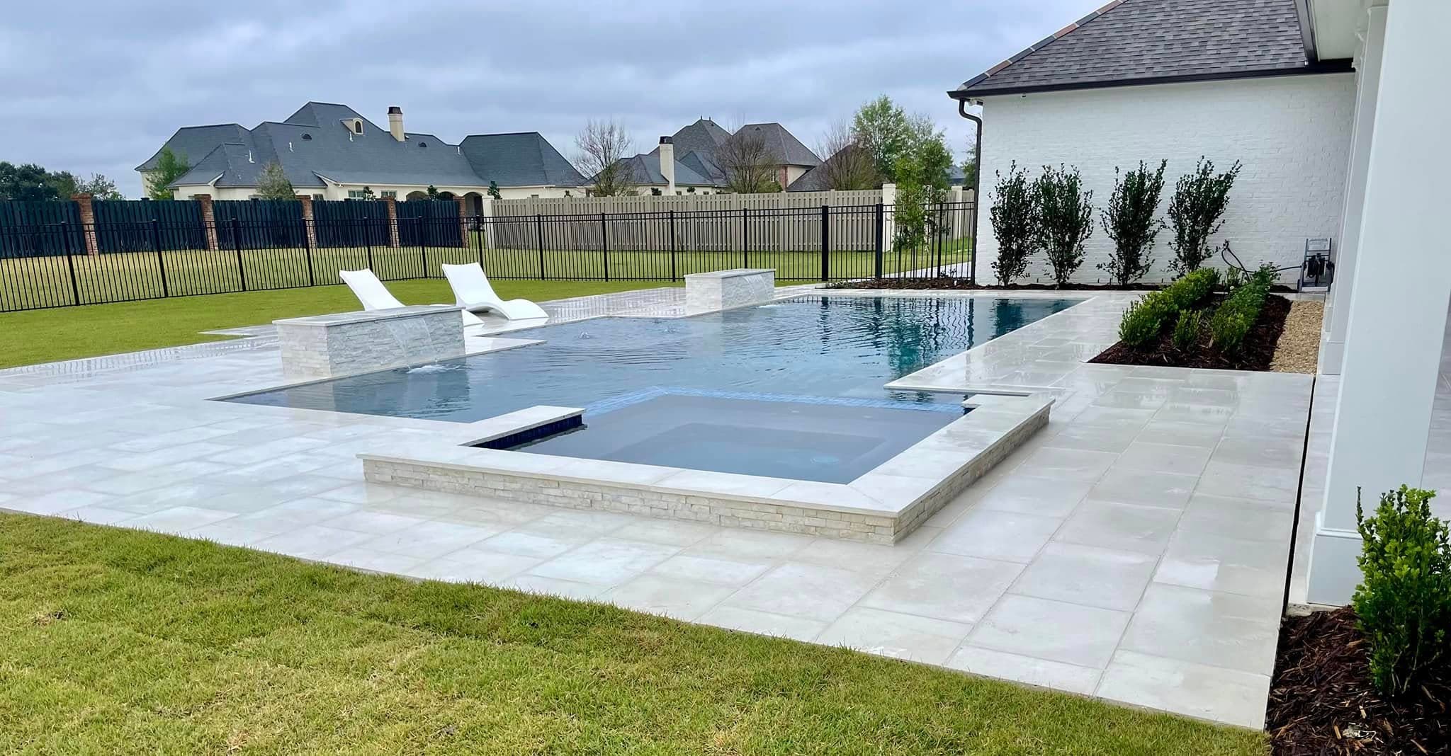 Custom pool with sun shelf and chaise lounges